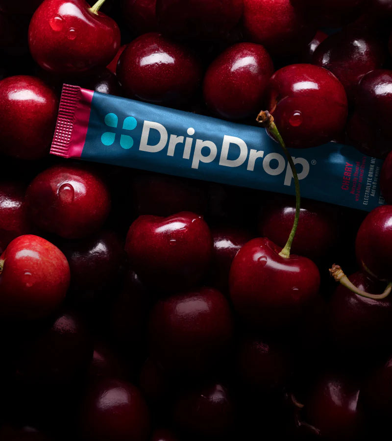 DripDrop electrolyte powder surrounded by cherries